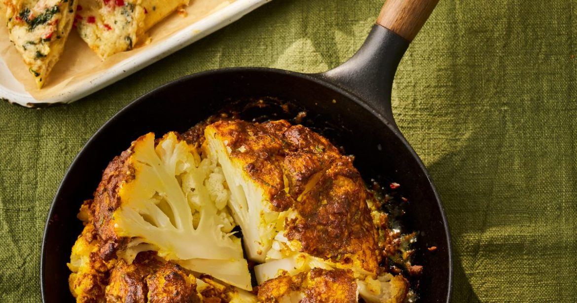 Whole cauliflower tikka masala with cheesy naans